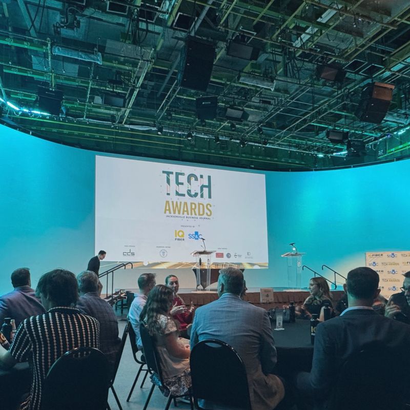 Guests seated in front of the Jacksonville Business Journal Tech Awards stage